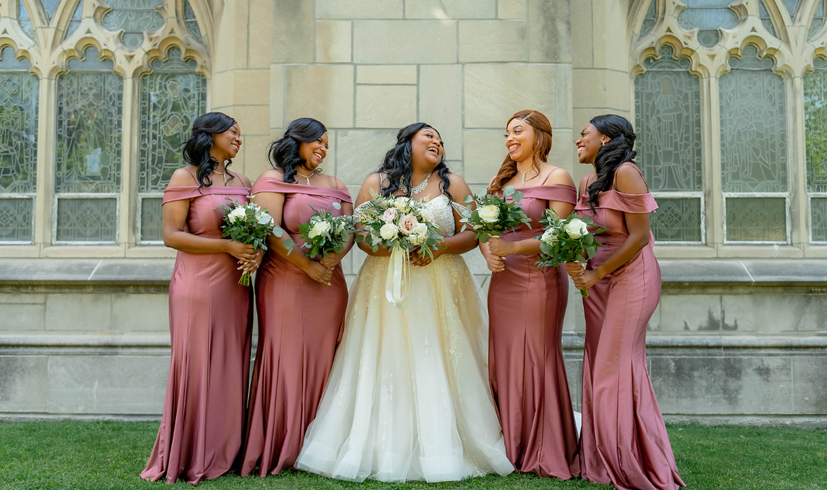 A joyful bride celebrating with her bridesmaids